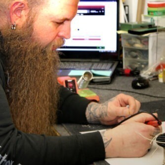 a person with a beard using a computer