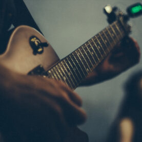 man playing electric guitar