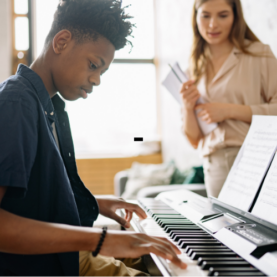 Music teacher giving a personalized lesson to a student